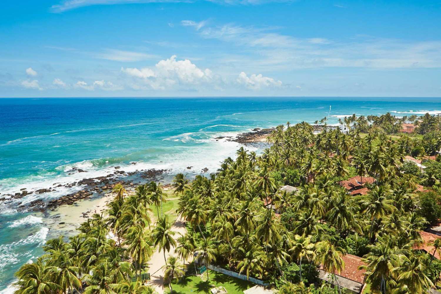 A Serene Beach With Houses