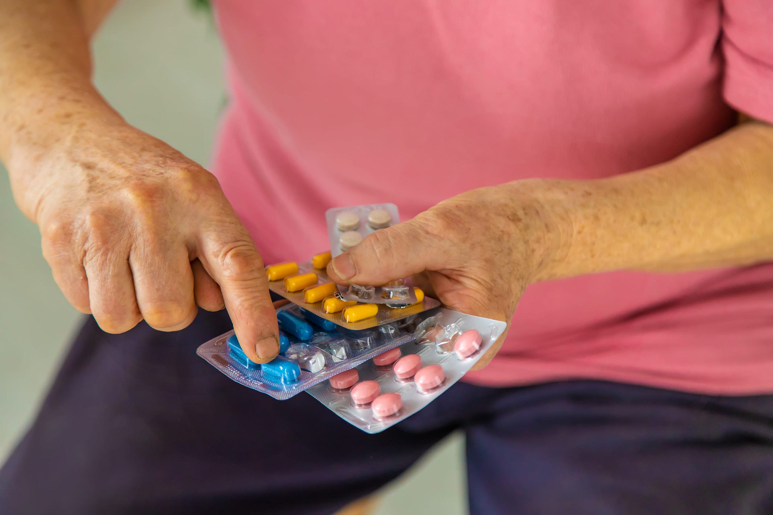 Old Traveller counting his medications