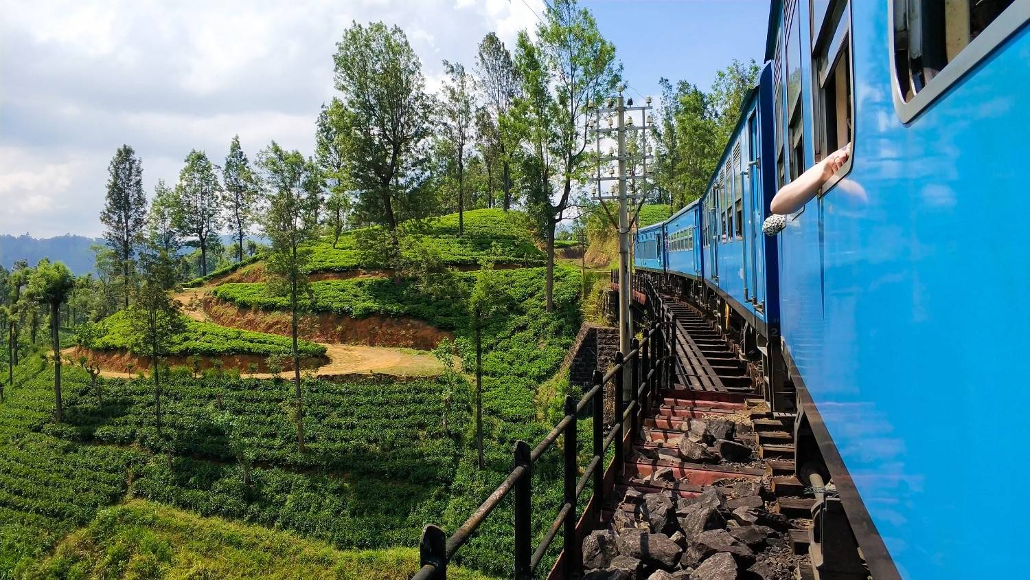 The Kandy to Ella Train travelling through fields