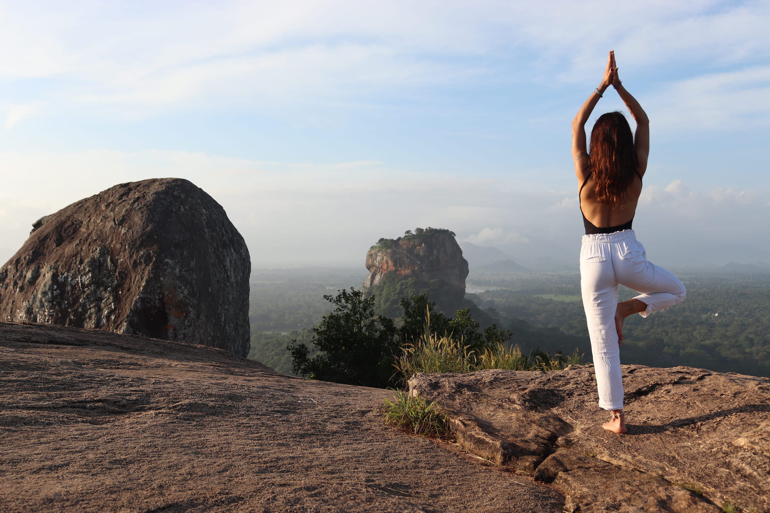 Woman doing yoga in Sigiriya, Sri Lanka